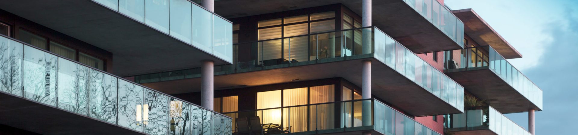 Balconies of a modern luxury apartments with a blue sky